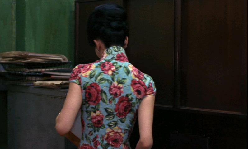 Maggie Cheung wearing a large floral print qipao (cheongsam) in the film In the Mood for Love