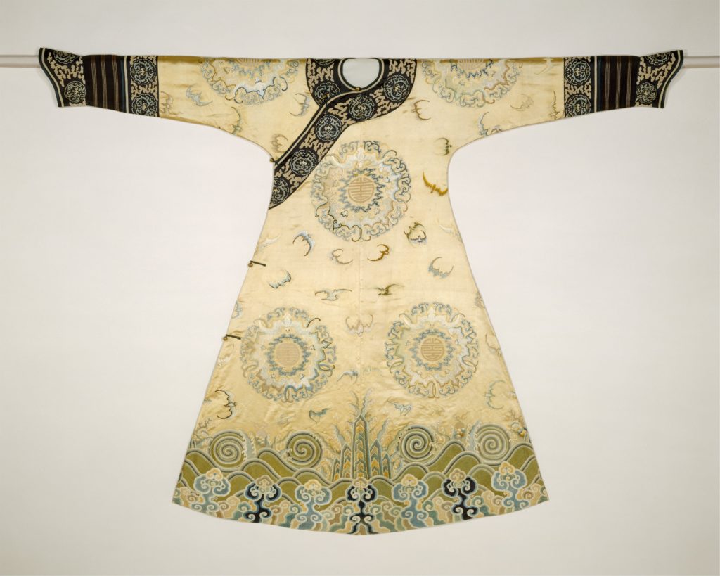A woman’s ceremonial qipao from the early Qing period with narrow sleeves and low collar; metmuseum.org