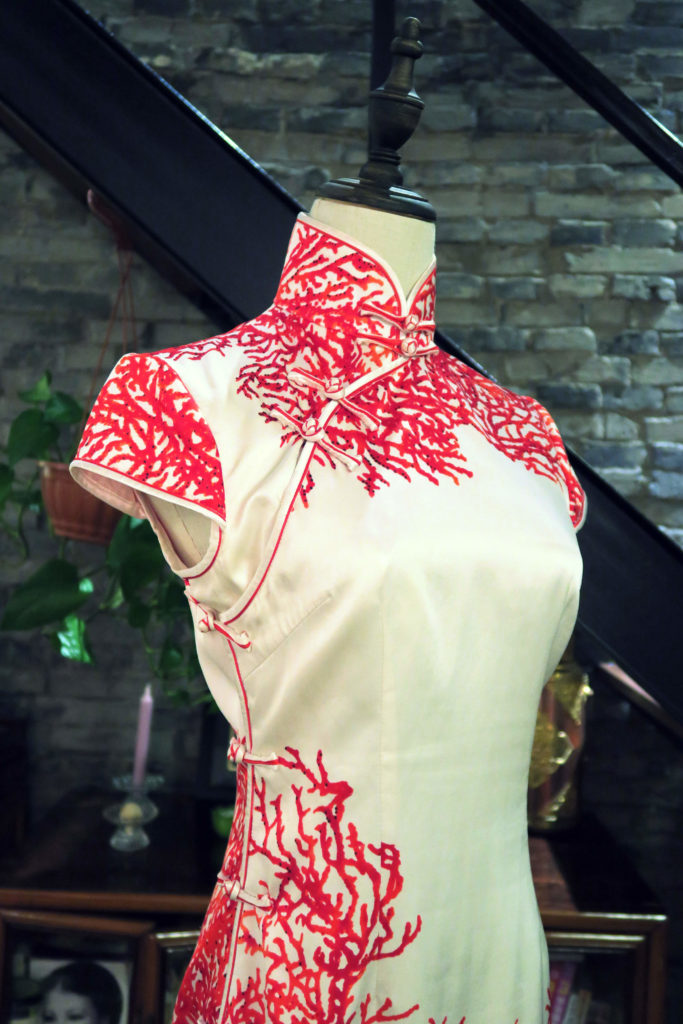 A close up of the qipao's front. The pankou (knotted buttons) are made from the same double piping which is used on the rest of the dress.