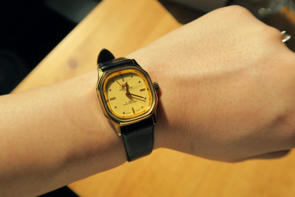 This one has a more vintage feel when worn with the skinny black strap and small watch face.