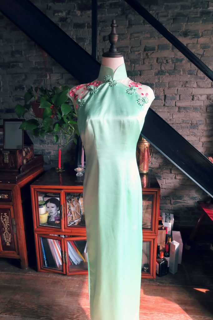 A complete view of the front of the dress. Just mint green except for the shoulder highlights. 