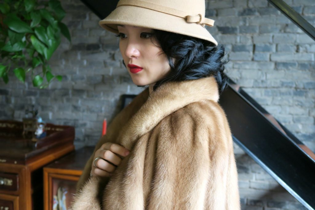 Wearing a qipao with my vintage fur jacket and wool bucket hat side view