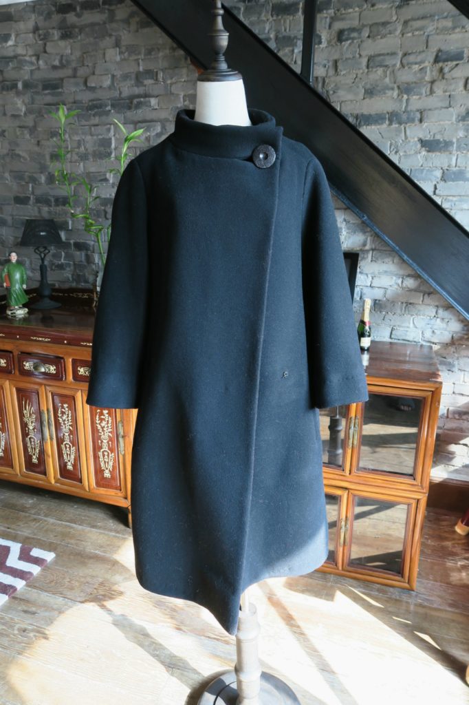 Vintage black 1950s bell shaped Christian Dior coat front