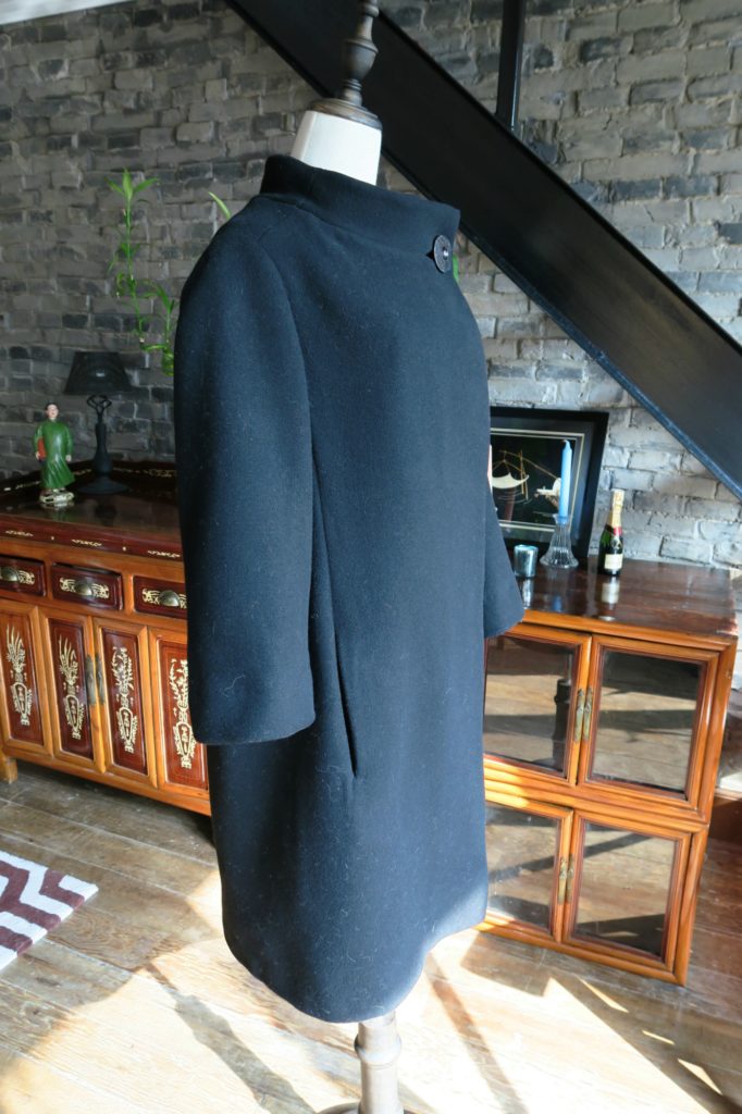 Vintage black 1950s bell shaped Christian Dior coat side