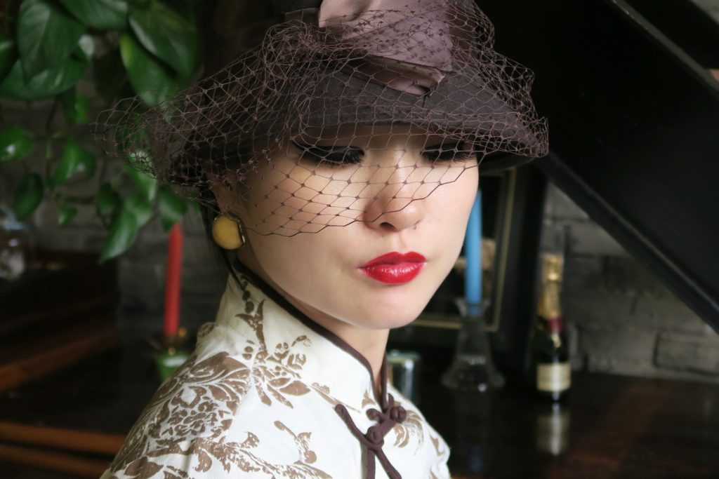 Accessorizing qipao cheongsam with bucket hat and netting