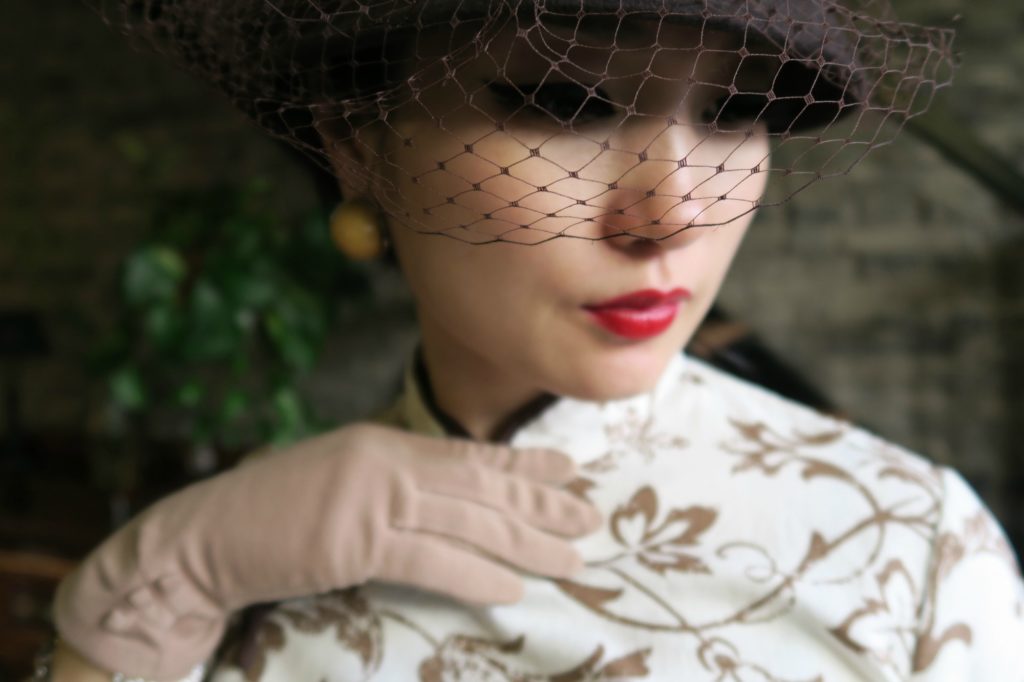 Accessorizing qipao cheongsam with bucket hat, netting and gloves