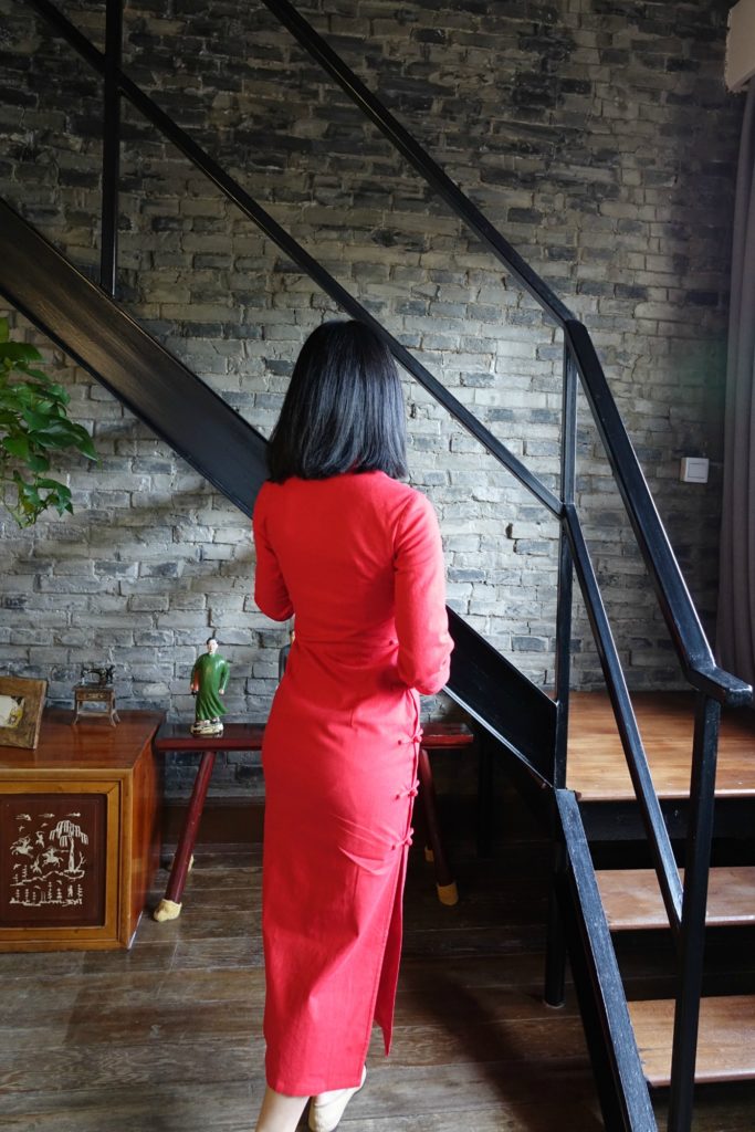 Wearing my traditional red qipao cheongsam with chanel flats - back view