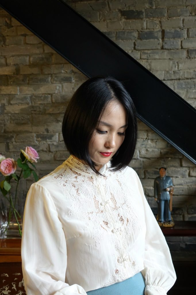 Wearing my vintage qipao cheongsam top with an aqua pencil skirt sitting down