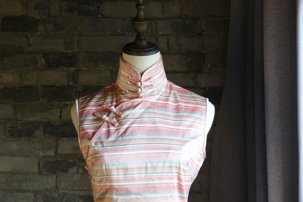 Pink striped sleeveless qipao cheongsam chest closeup