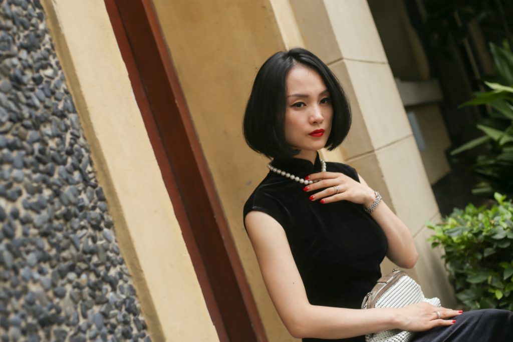 Miranda wearing black sleeveless velvet qipao Sinan Mansions