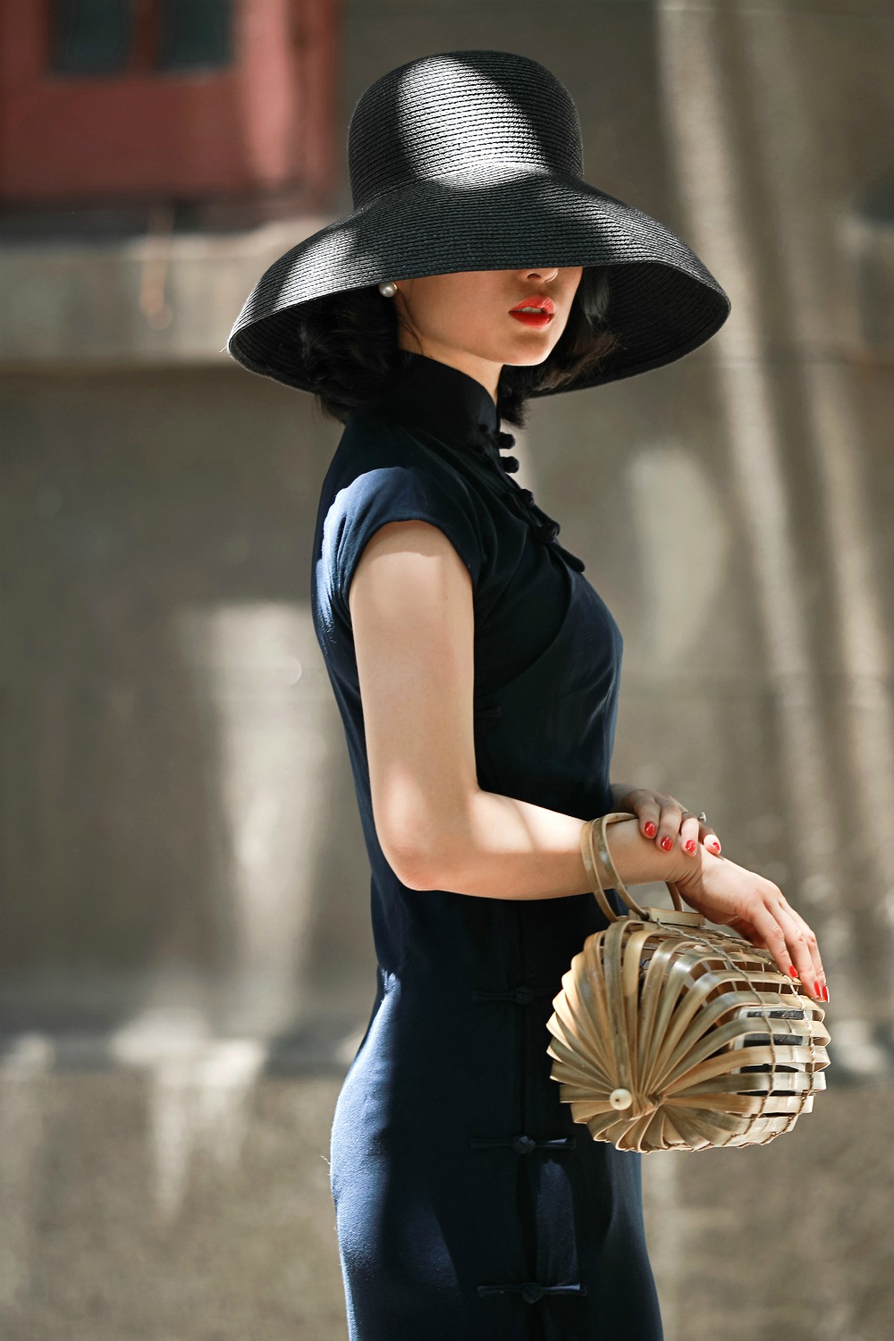 Cotton viscose navy cap sleeve qipao with black mushroom hat and bamboo bag
