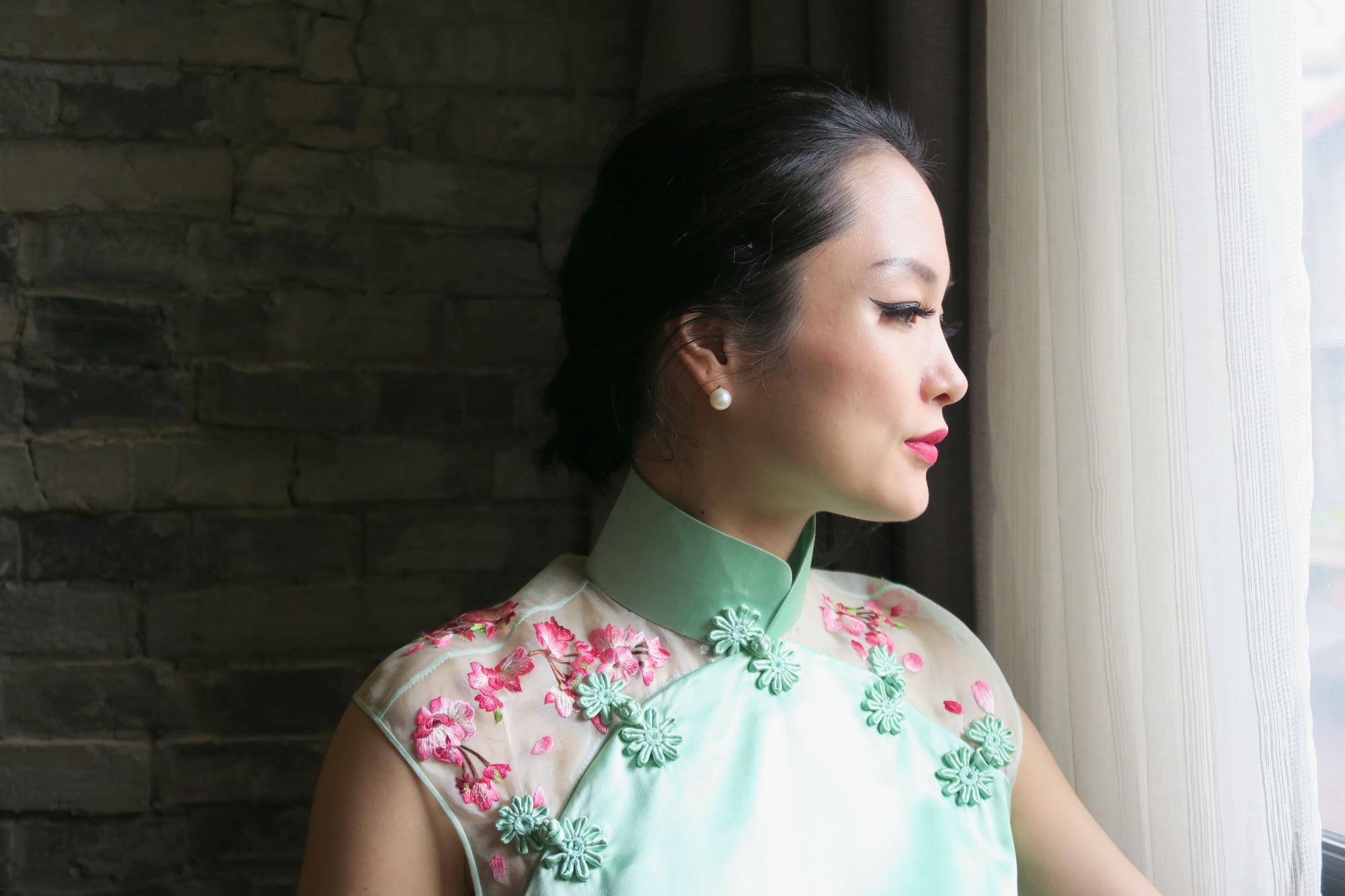 Miranda wearing mint green qipao